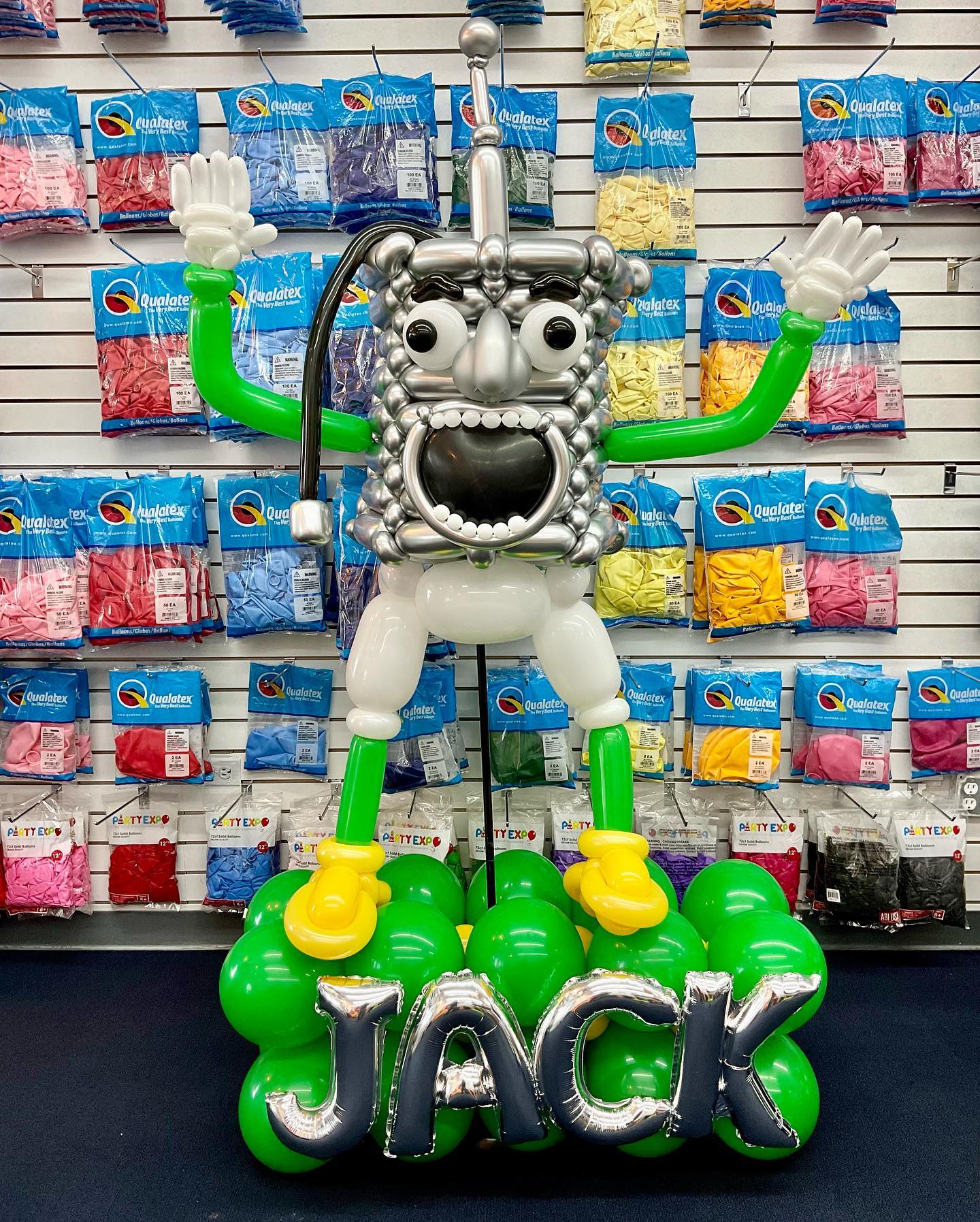 A balloon sculpture with the name jack on it