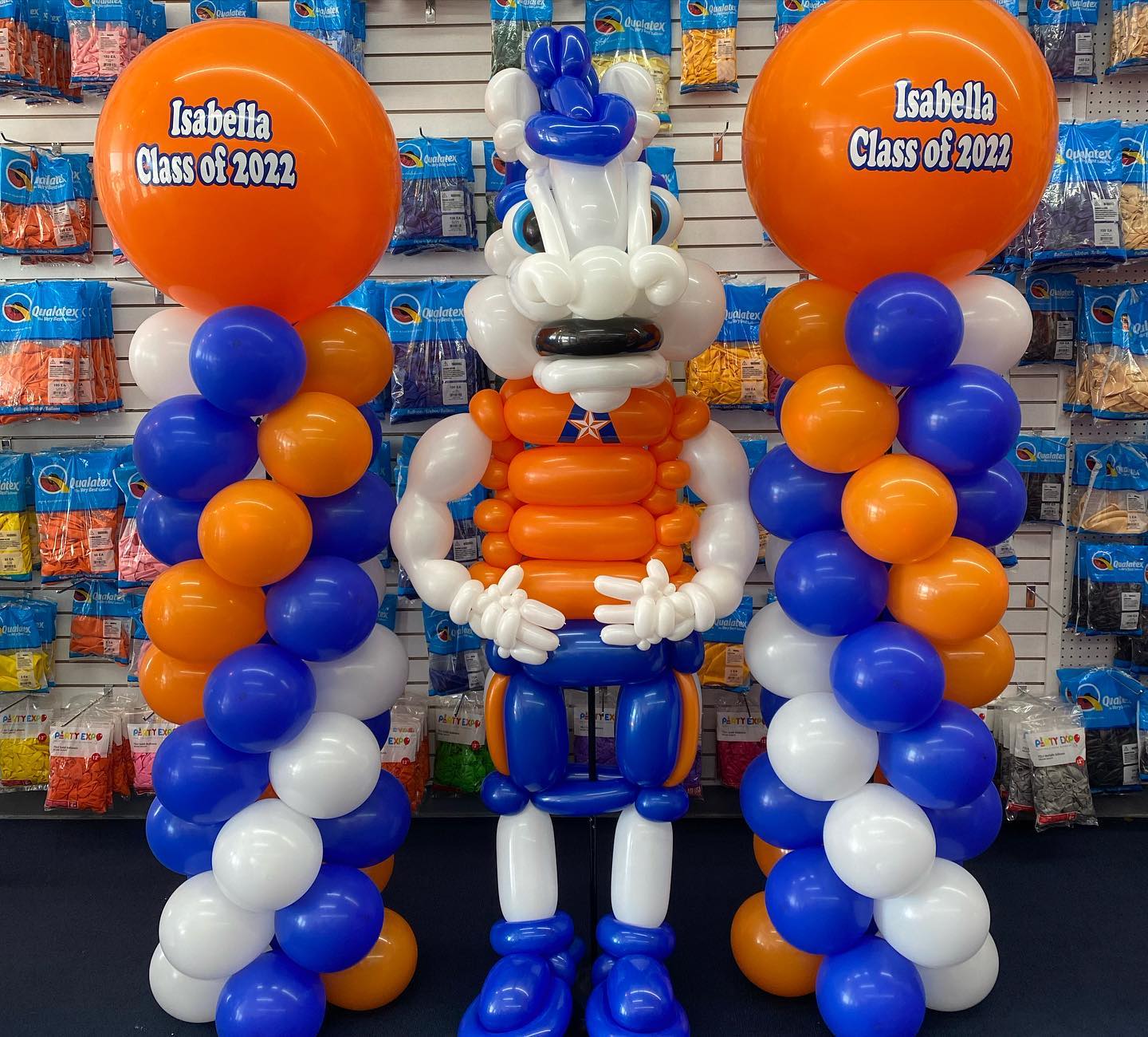 A bunch of balloons with one that says ' isabella ' on it