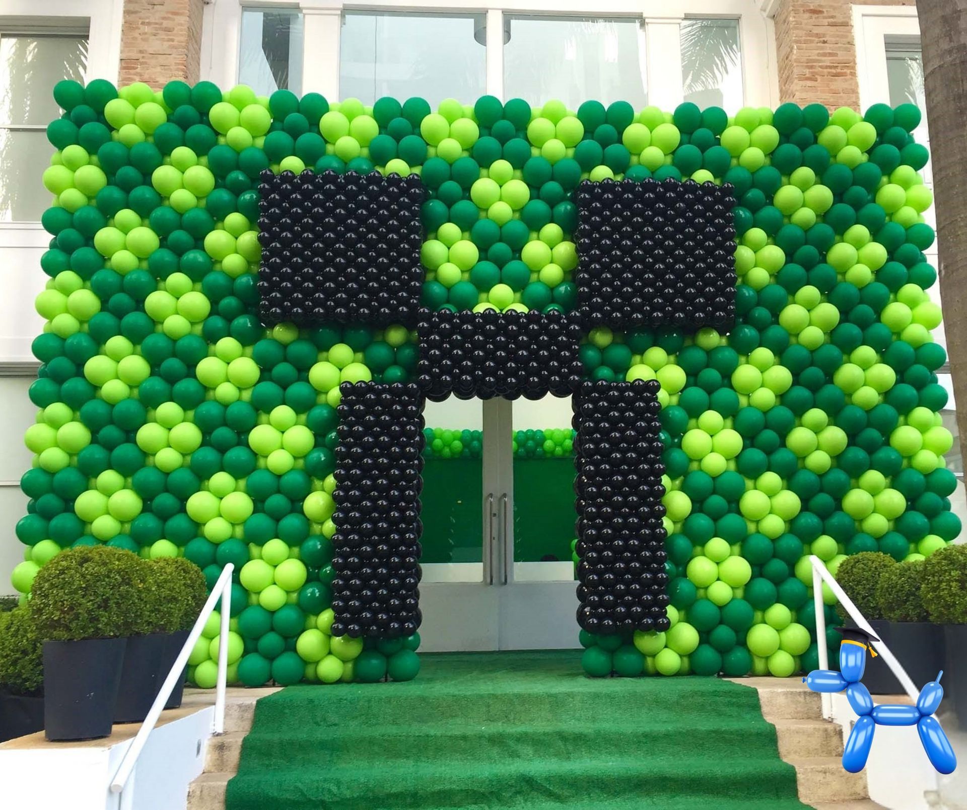 Minecraft balloon wall sculpture or the character creeper in black and shades of green balloons