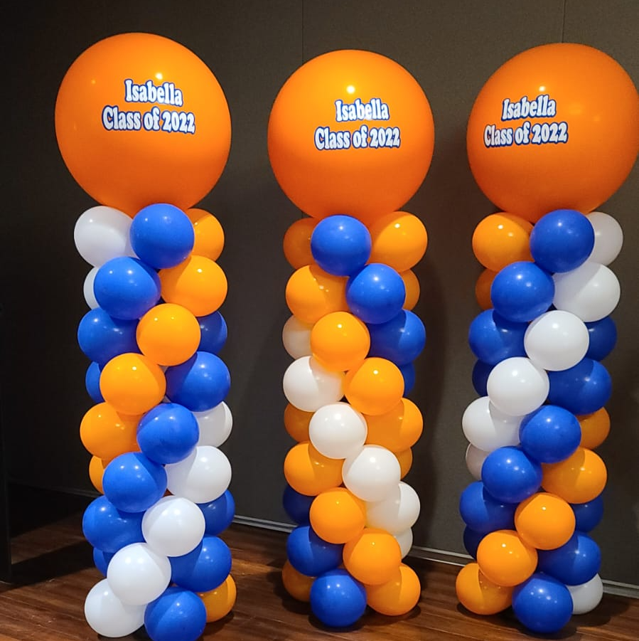 Three orange balloons that say isabella class of 2012