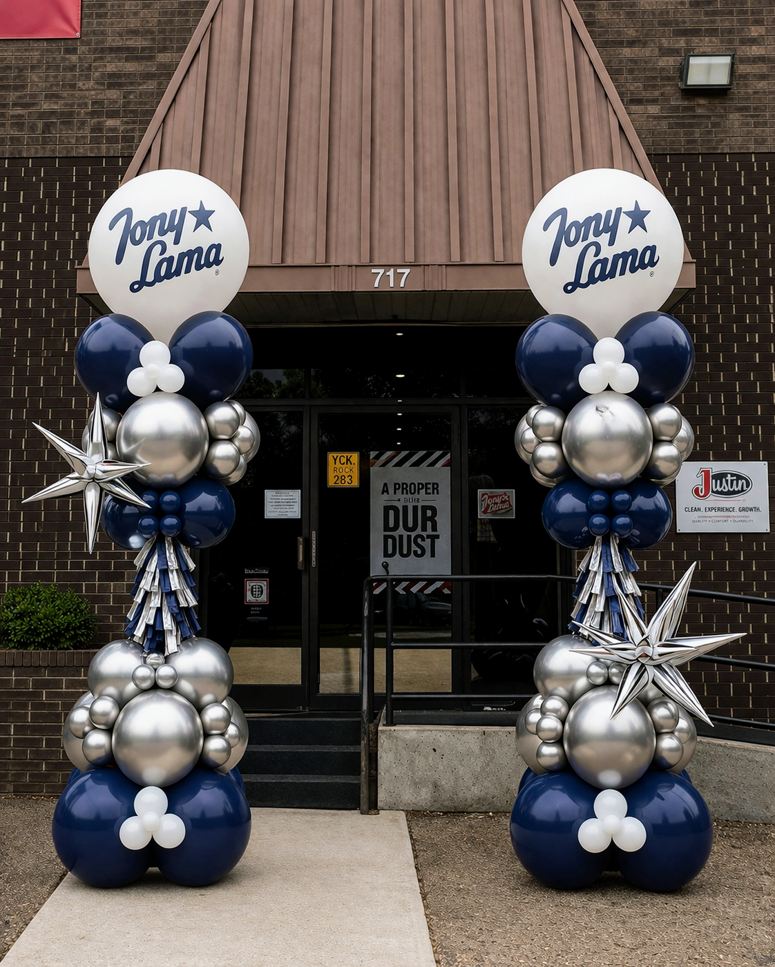 Corporate balloon column decor for Tony Lama in company colors and a company logo, accented with fun balloon styles.
