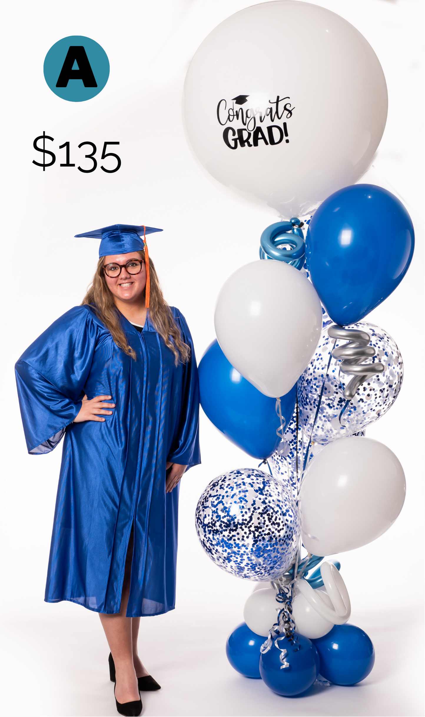 A woman in a graduation cap and gown is standing next to a bunch of blue and white balloons.