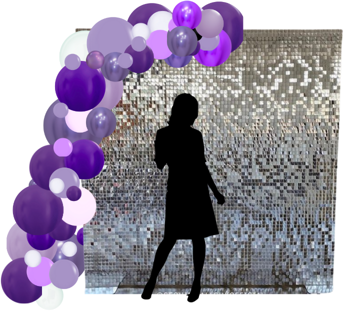 A silhouette of a woman standing in front of purple balloons
