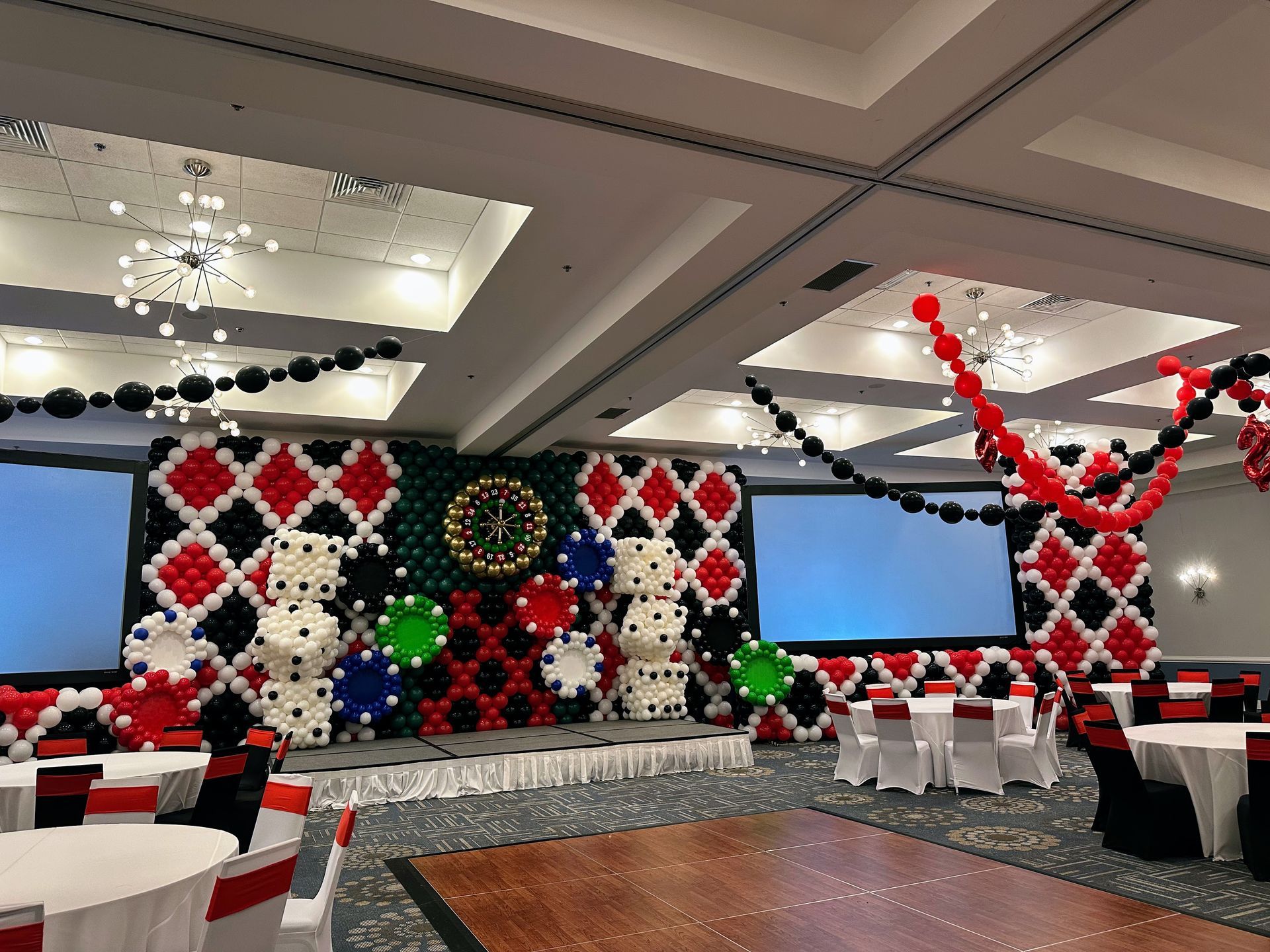 Graduation balloon décor featuring blue and silver balloons spelling “SHINE” for a graduation celebration