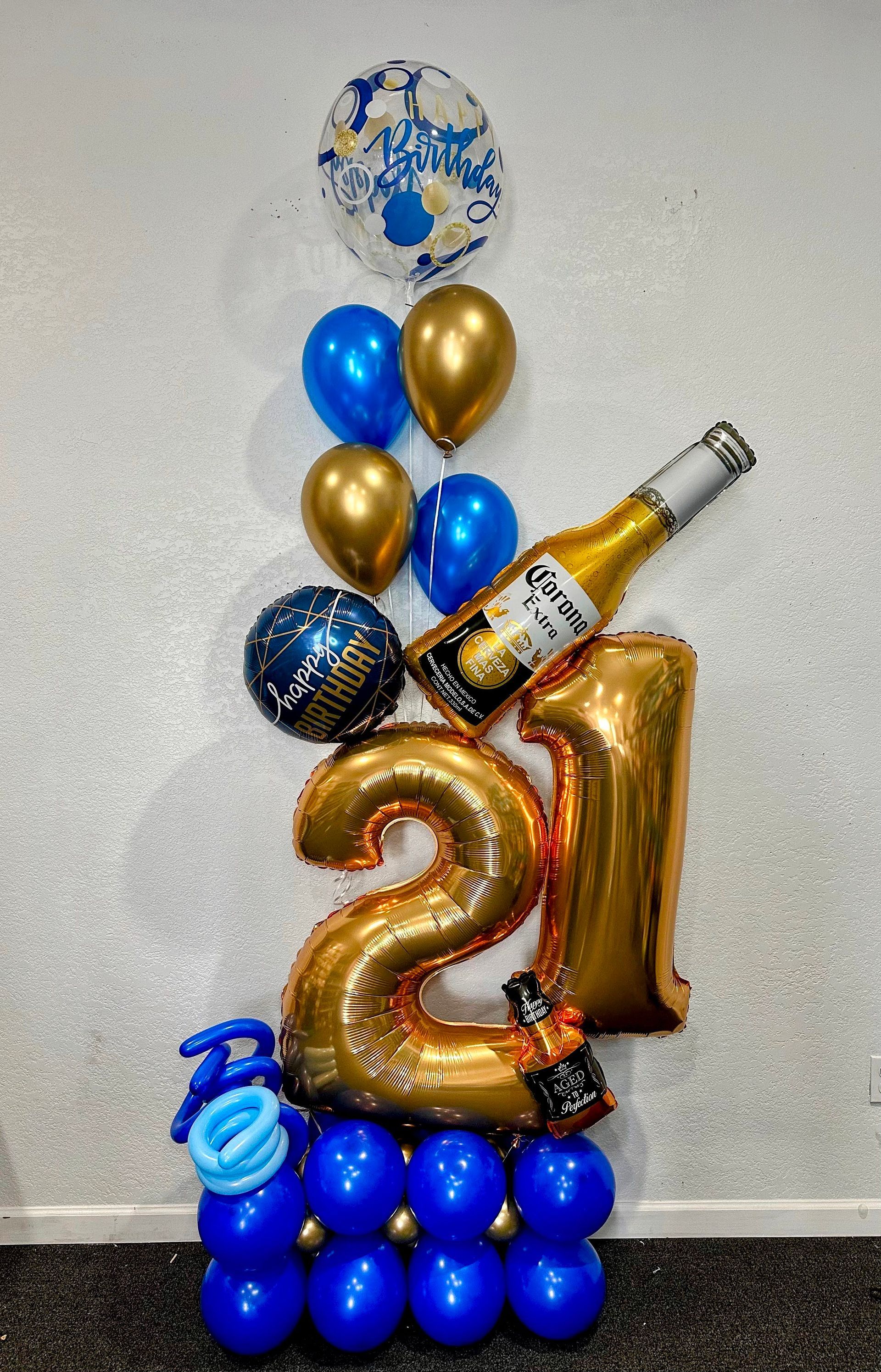 A bunch of balloons with a bottle of beer on top of them.