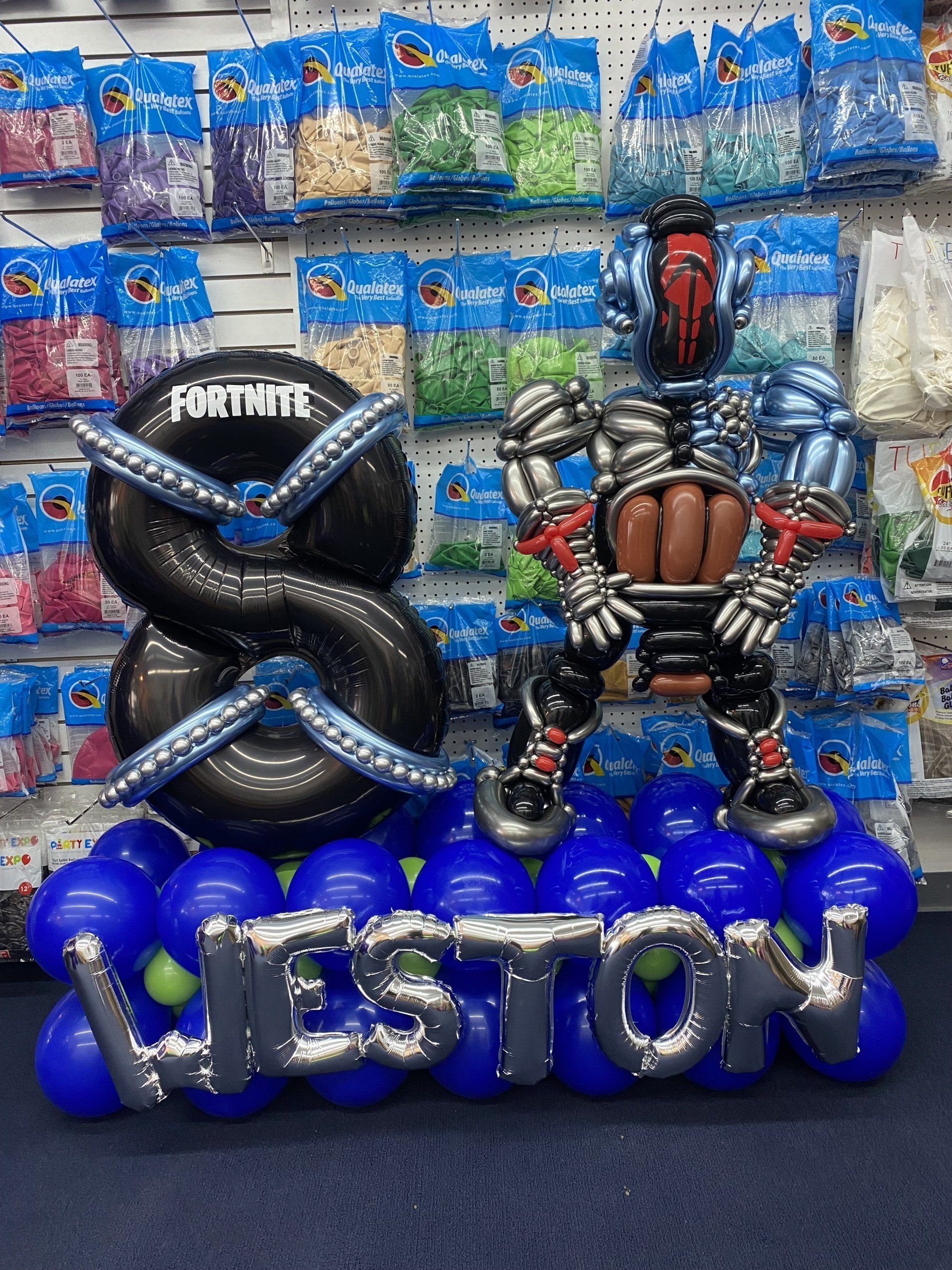 A bunch of balloons with the name weston on them