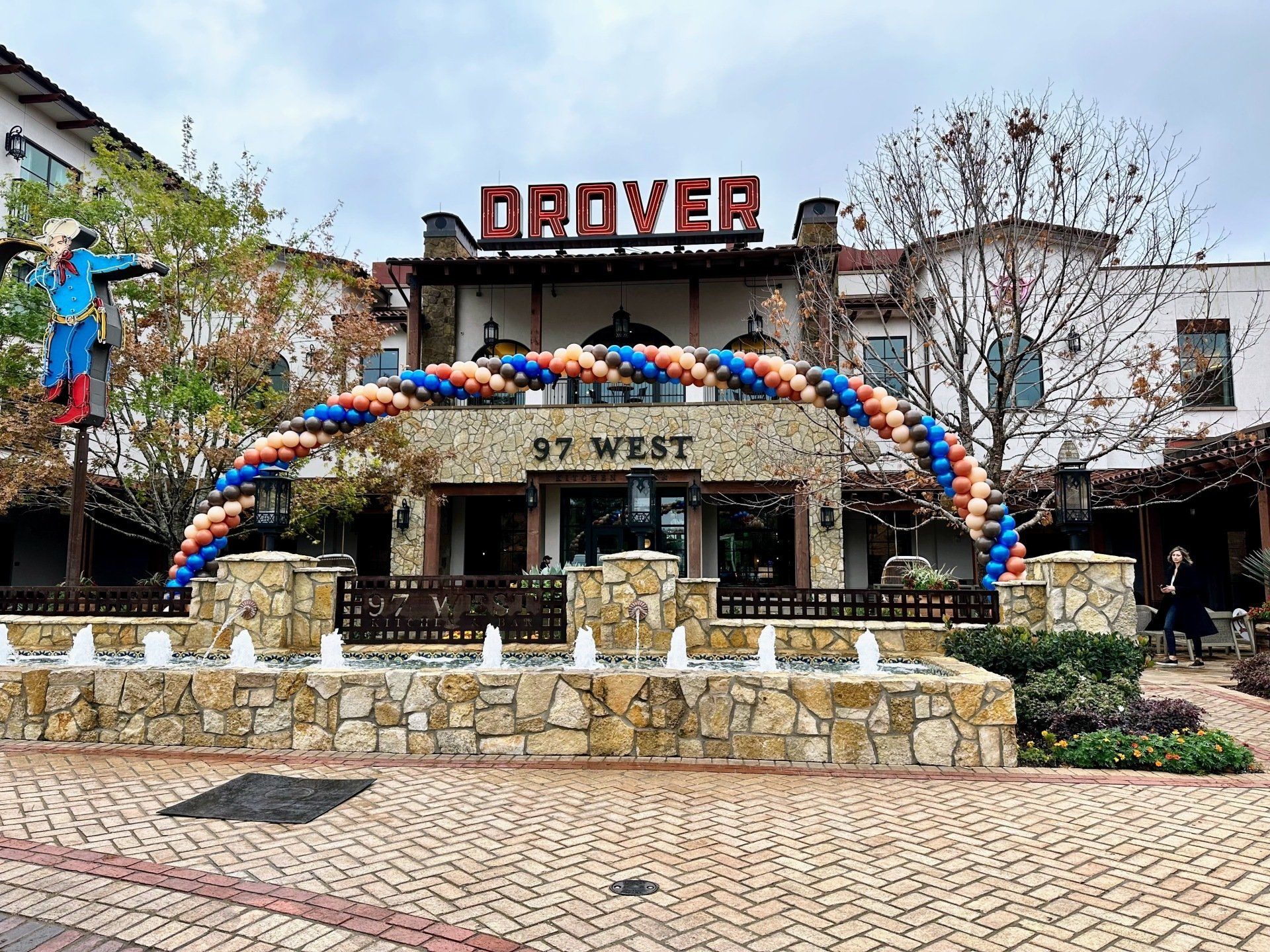 A large building with balloons in front of it.