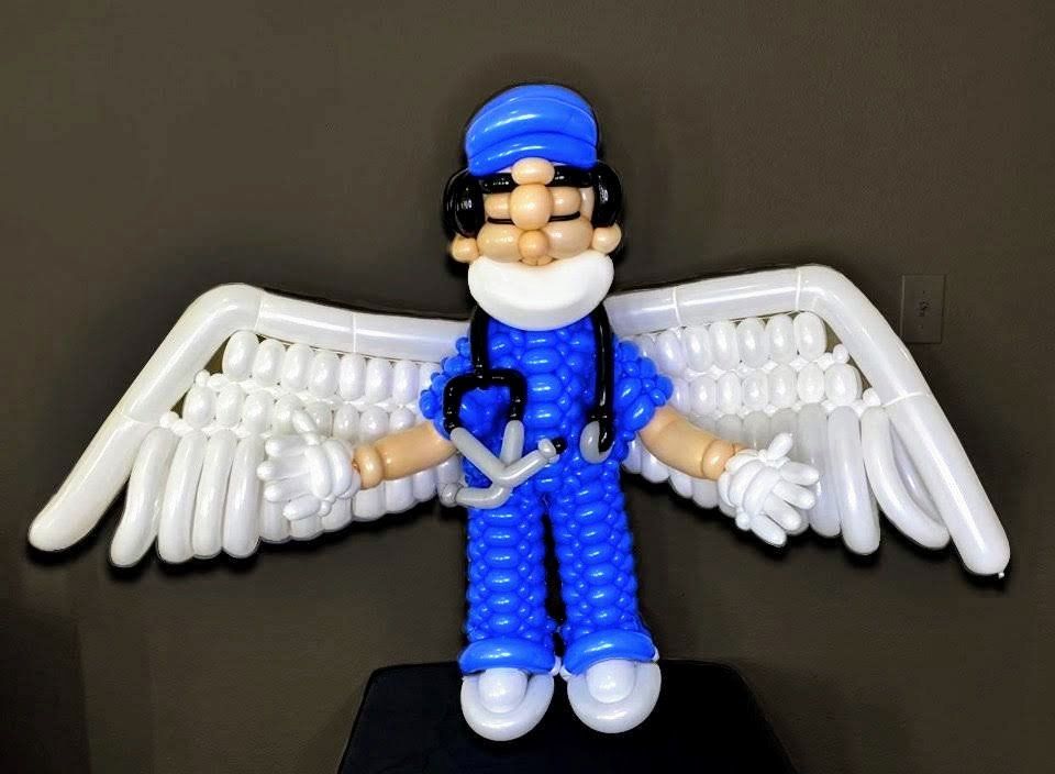 A balloon figure of a doctor with wings and a stethoscope
