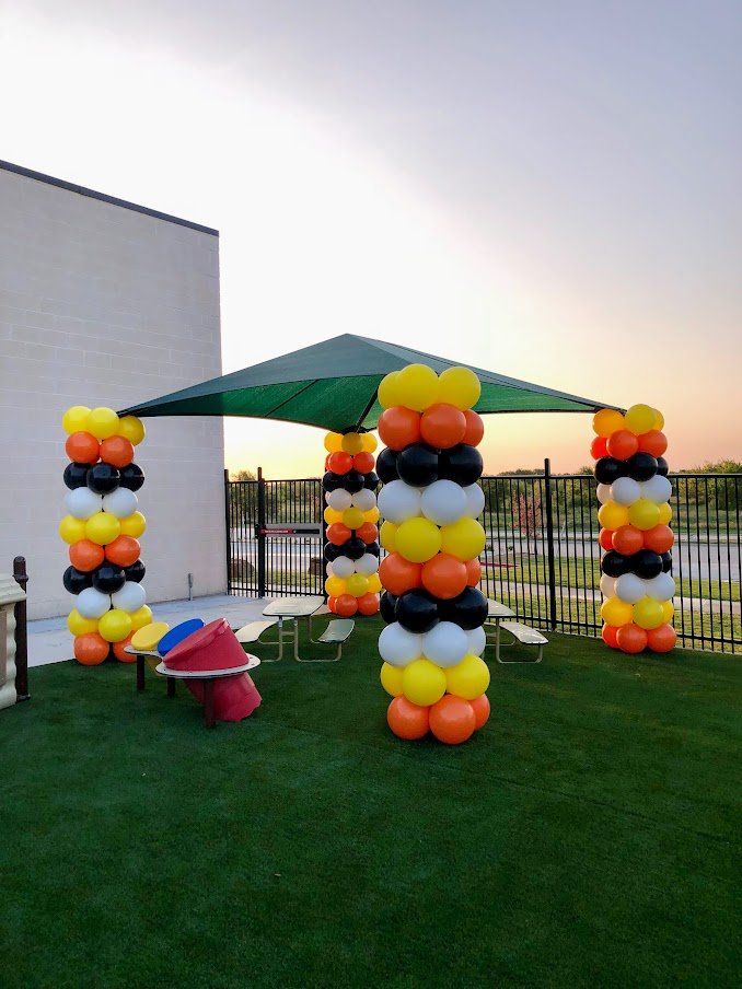 A bunch of balloons are stacked on top of each other