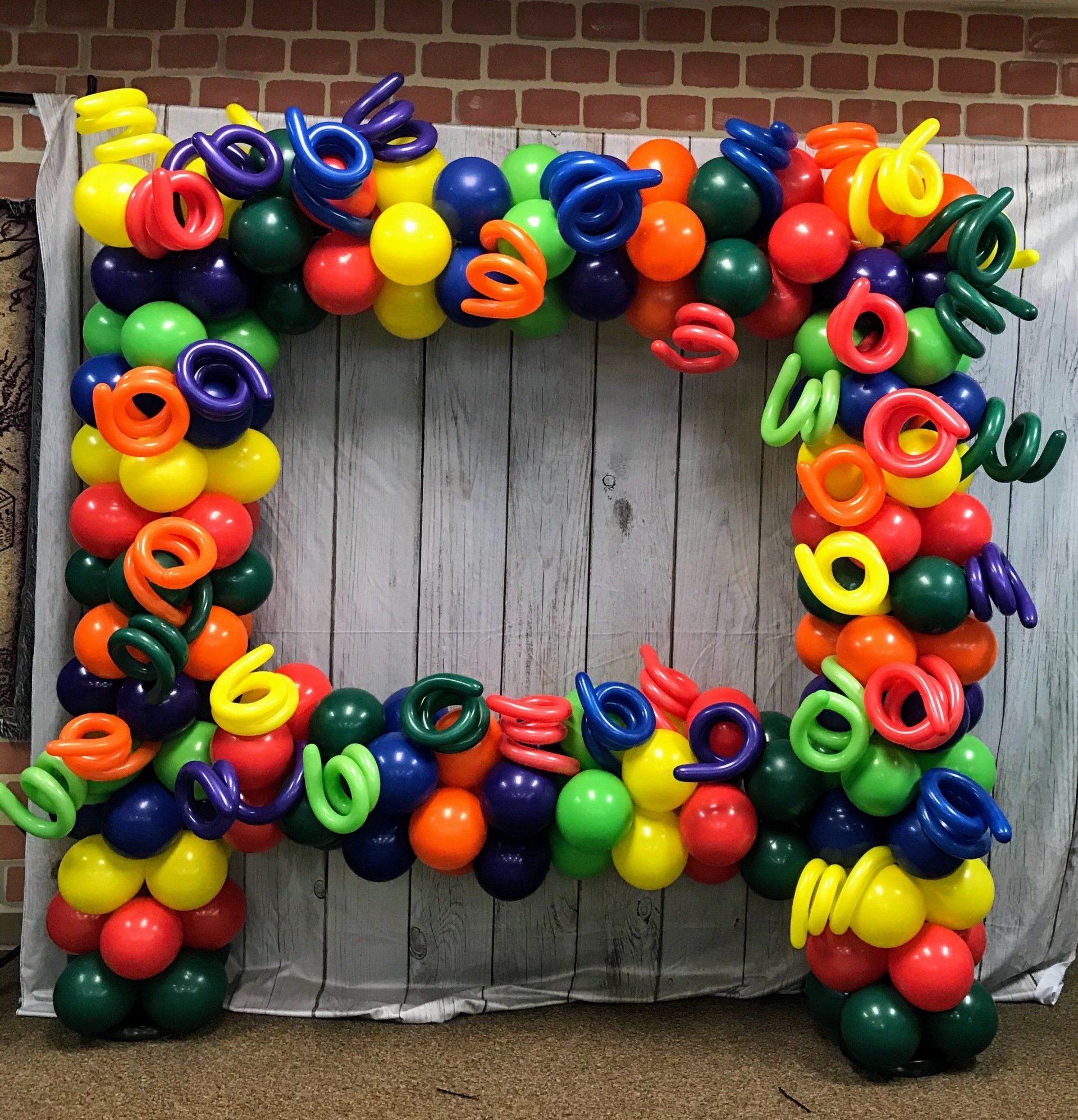 A picture frame made out of colorful balloons