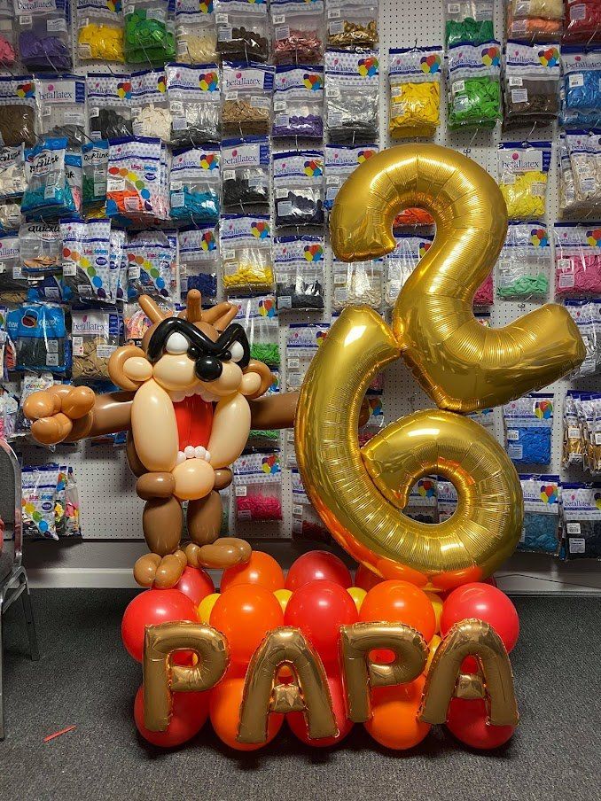 A bunch of balloons with the word papa on them