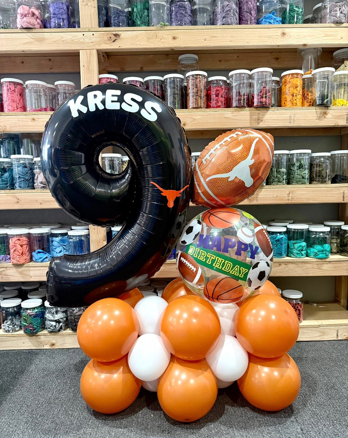 Number balloon marquee bouquet with themed accents for birthdays, school events, and celebrations