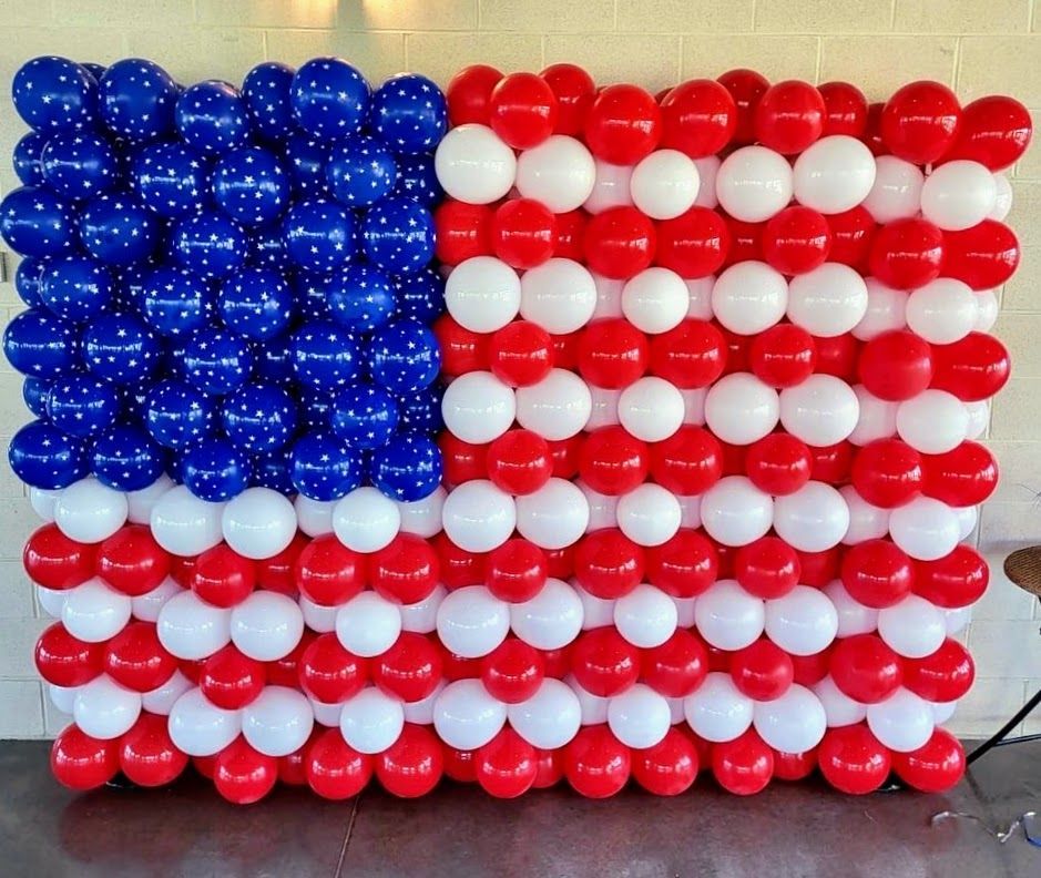 An american flag made of red white and blue balloons
