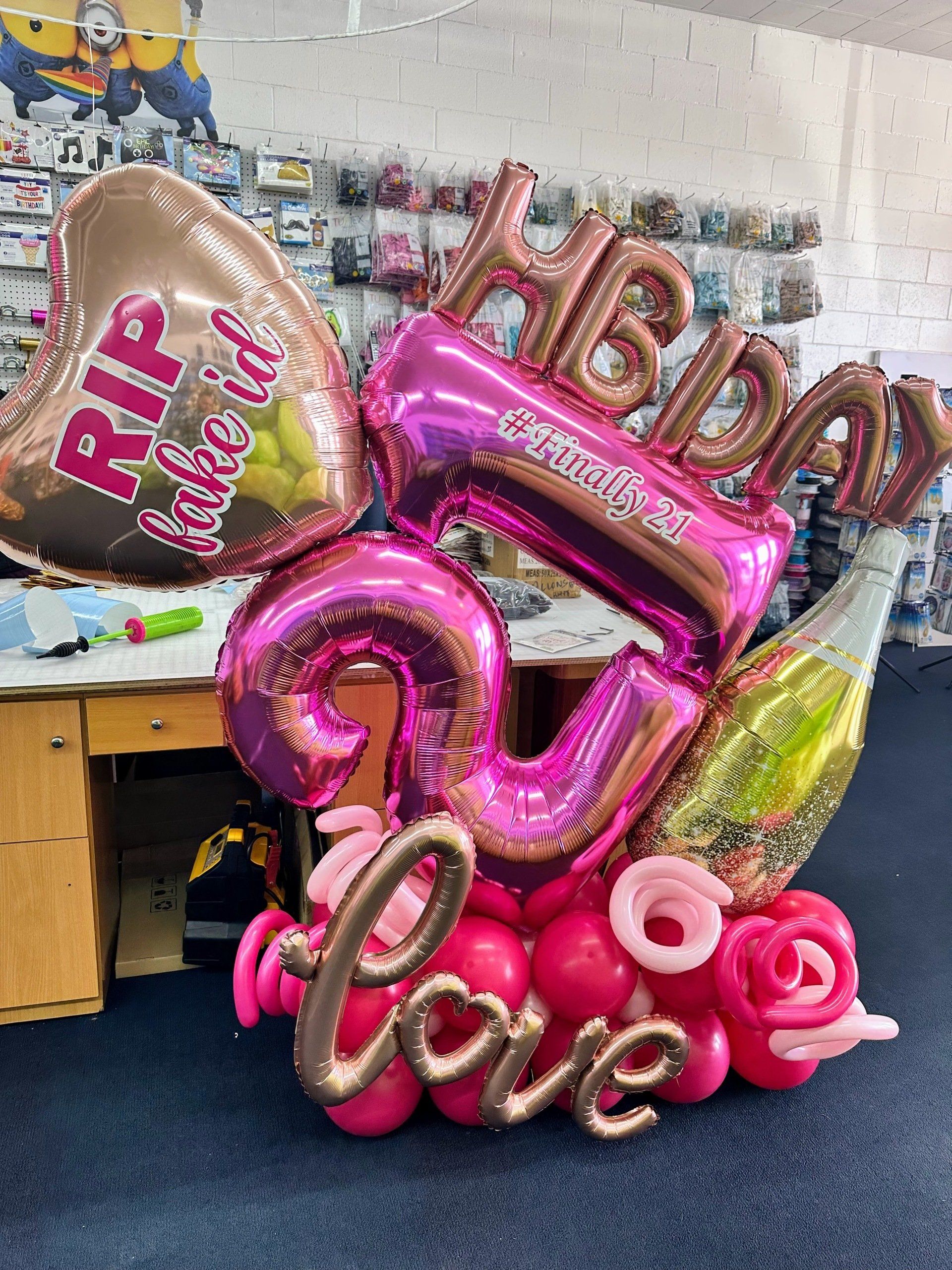A bunch of balloons are sitting on top of each other in a room.