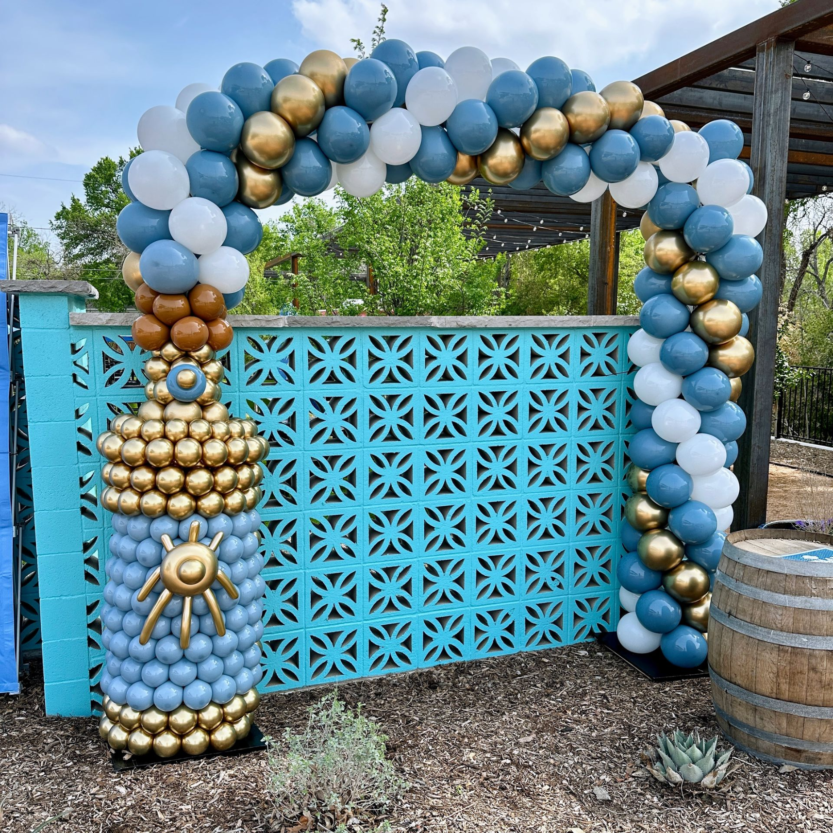 Outdoor corporate balloon arch with coordinated balloon columns for branded business event
