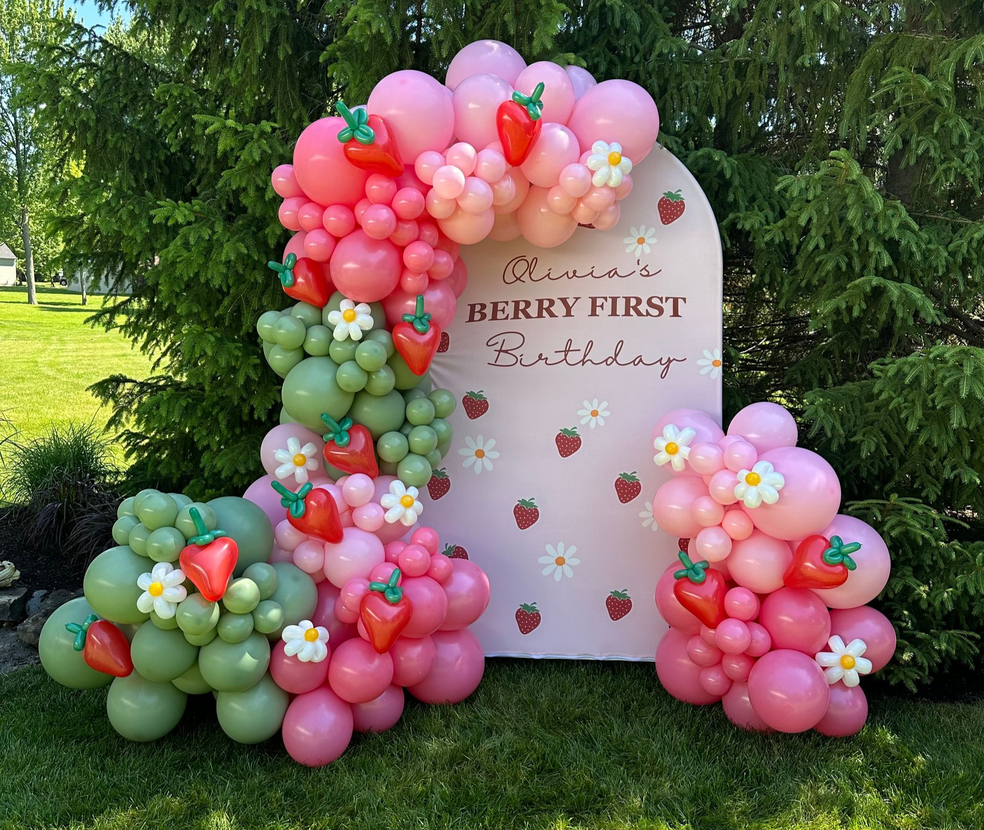 Balloon garland with pink floral theme for birthday backdrop and event decor in Fort Worth Texas