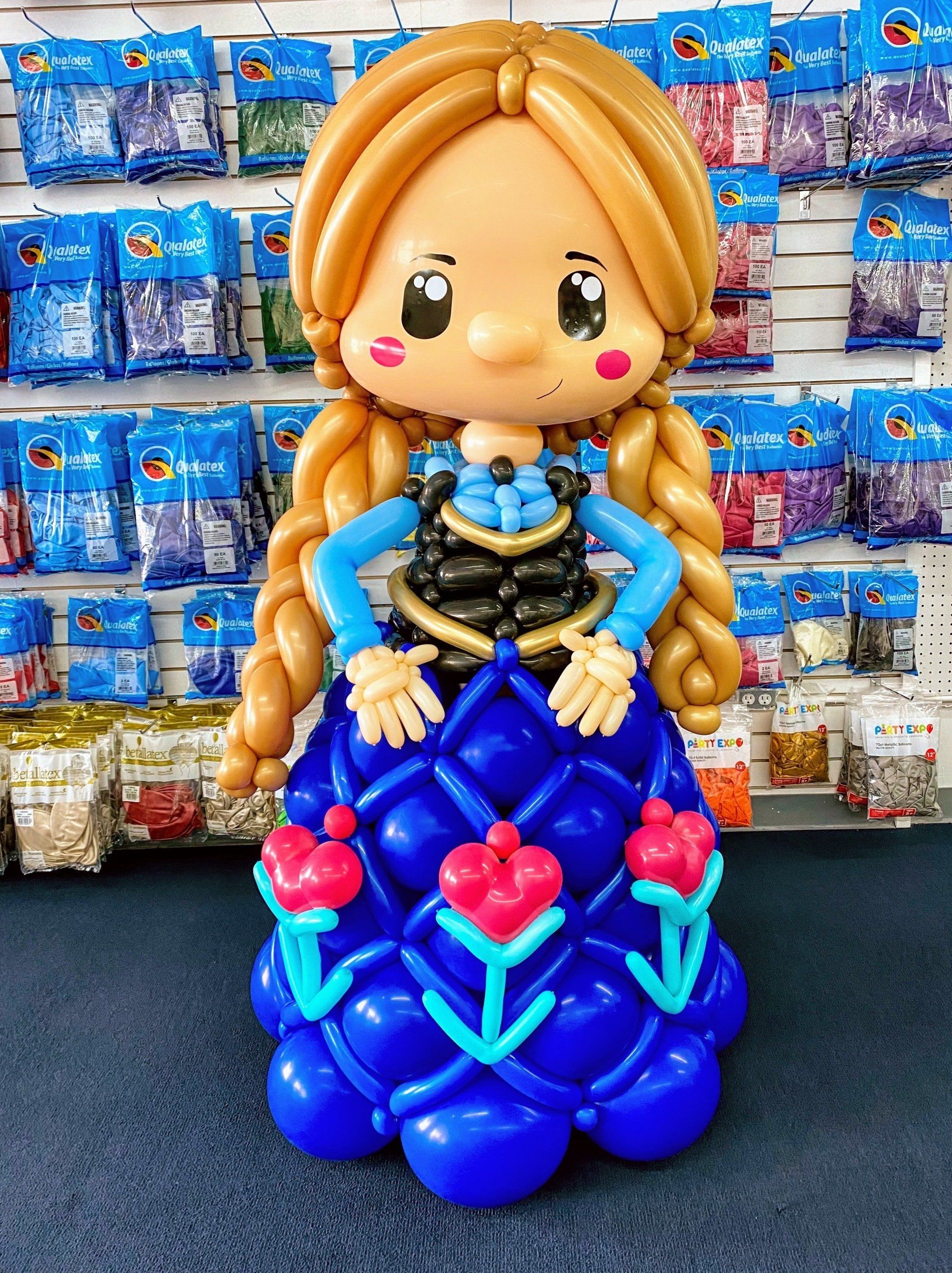 A doll made out of balloons in a store