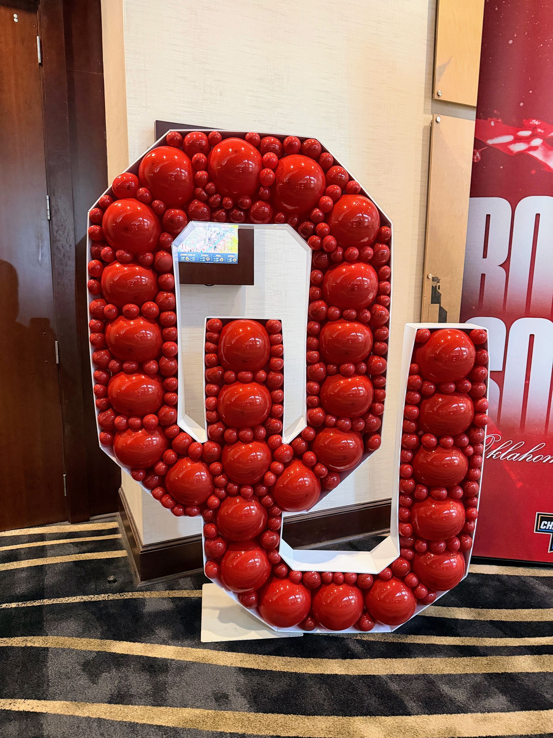 OU balloon mosaic letters in red and white for university themed event decor in Fort Worth