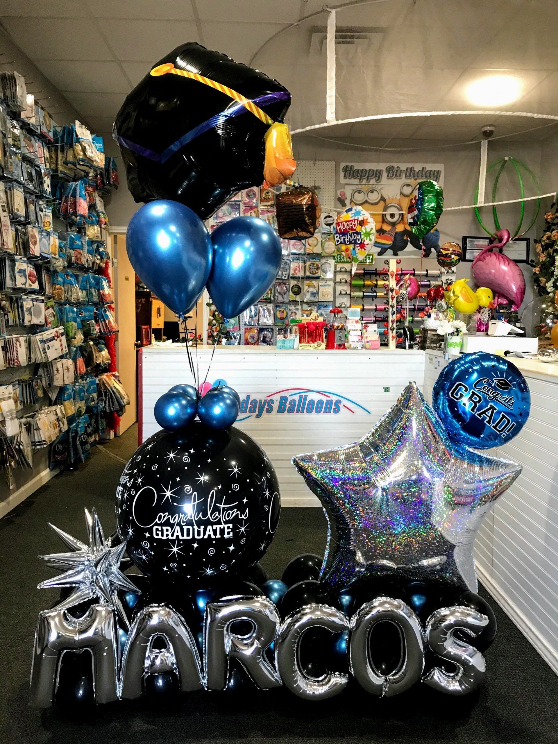 A bunch of balloons with the name marcos on them