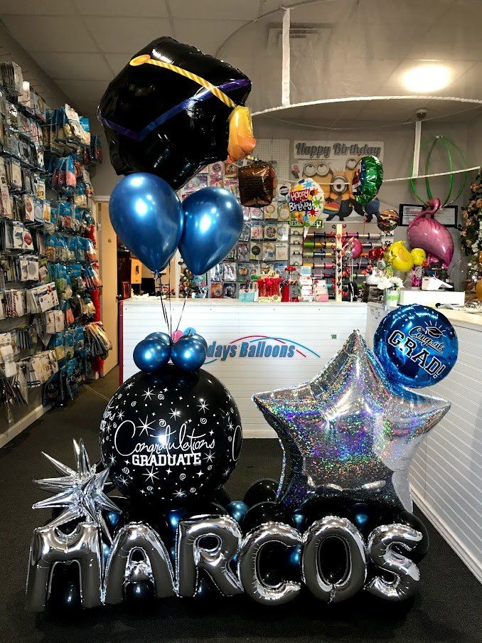 A bunch of balloons with the name marcos on them