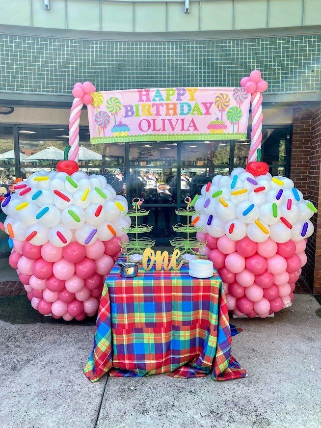 Two giant cupcakes made out of balloons for a birthday party
