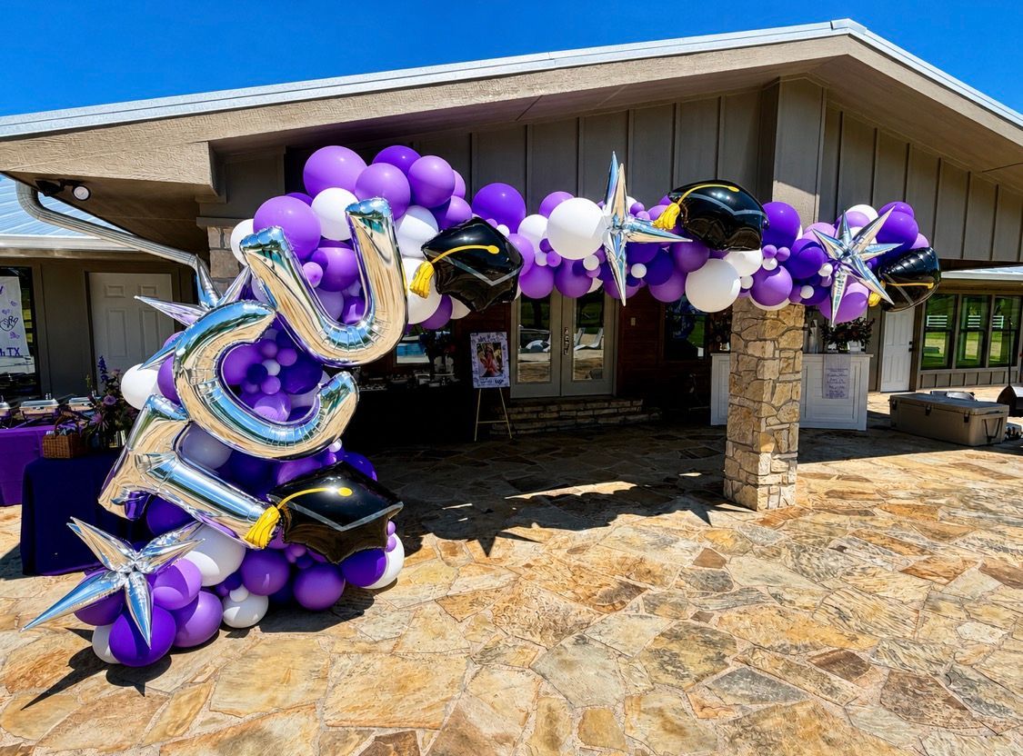 A graduation balloon garland with TCU foil letter balloons and matching college colors.