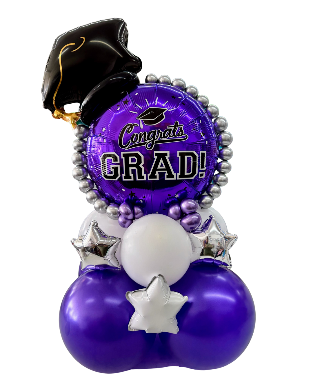 A  graduation balloon column or graduation centerpiece featuring a large round purple foil balloon prominently displaying 