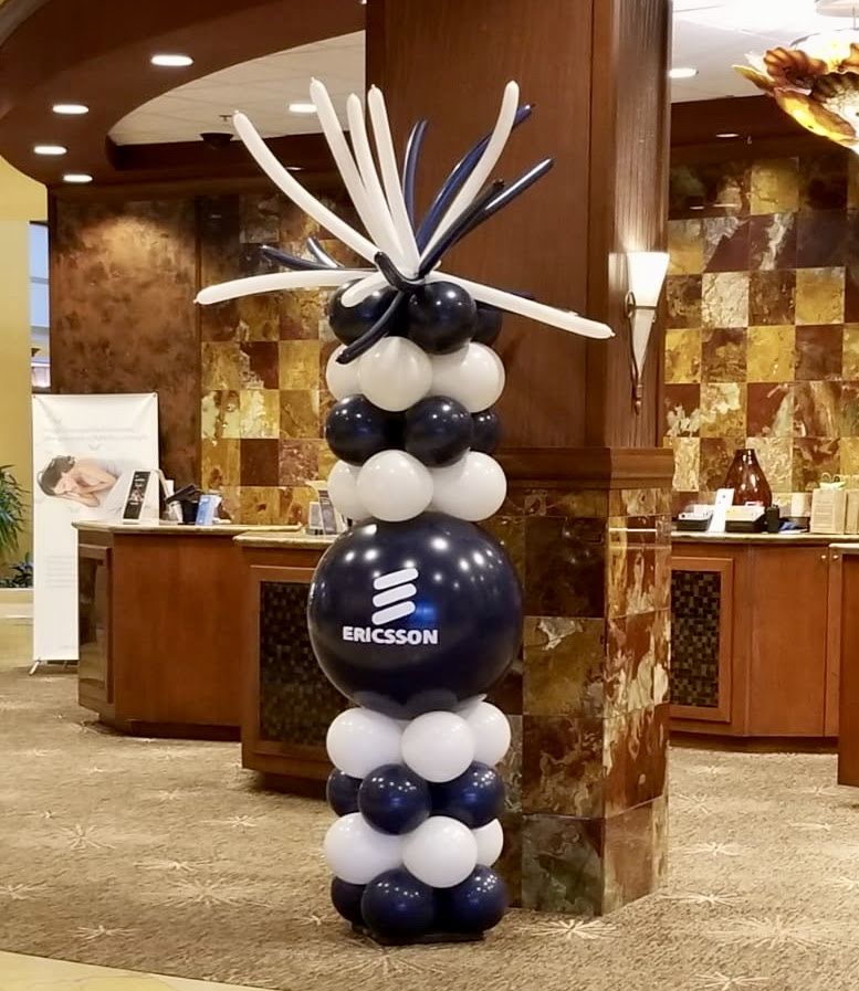 A balloon tower with the word precision on it