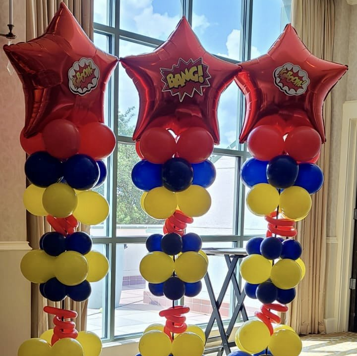 A bunch of balloons with one that says bang on it