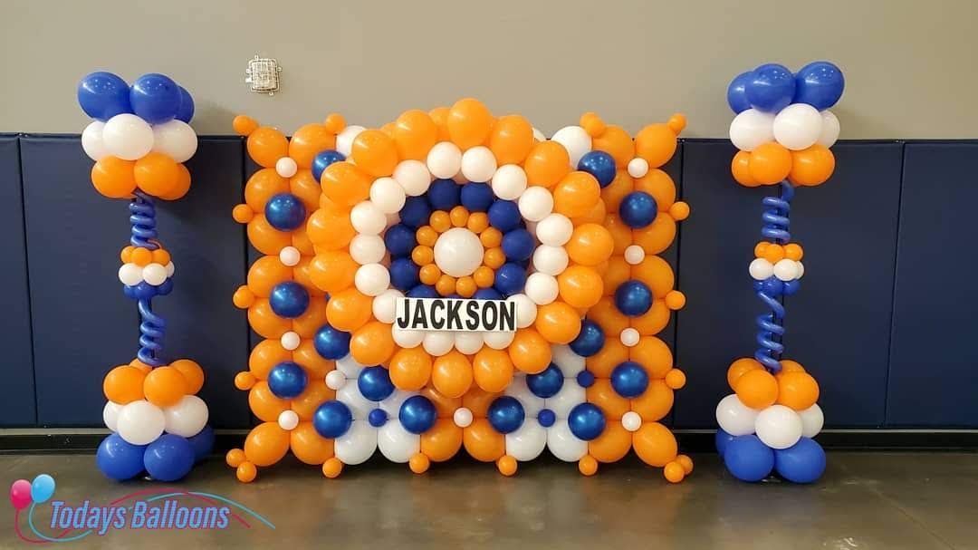 A wall of balloons with the name jackson on it