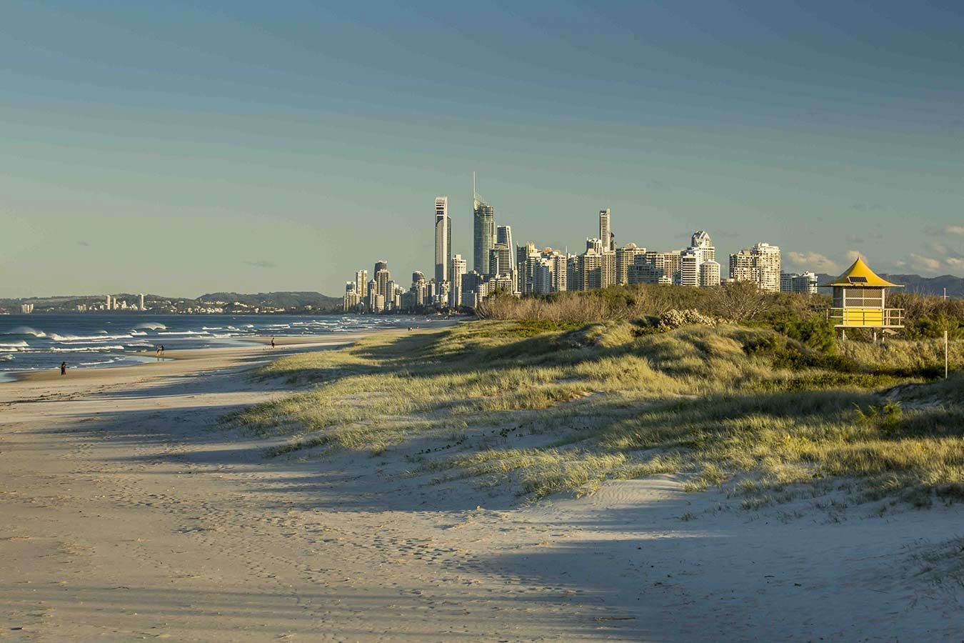 A Beach A Lifeguard Hut In The Foreground — Salt Building & Pest Inspections in Merrimac, QLD