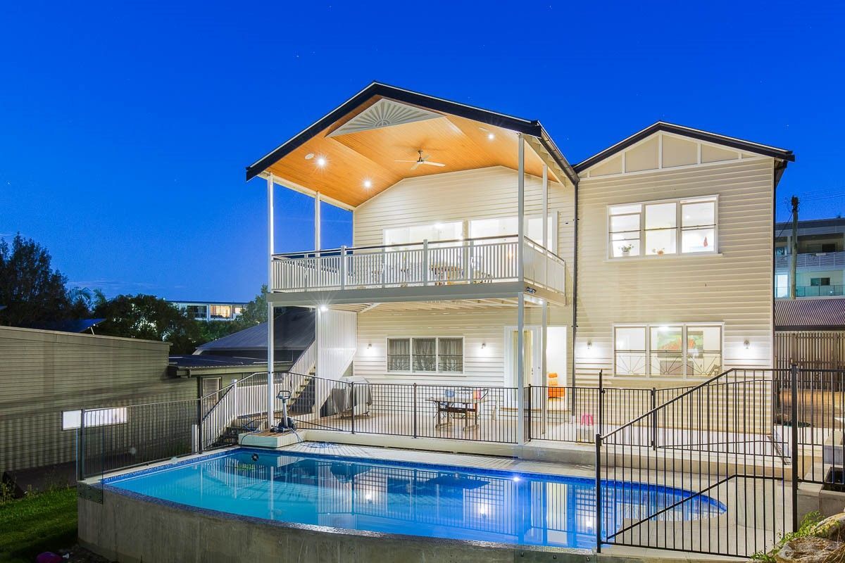 A Man In A Protective Suit And Spraying Chemicals In A Factory — Salt Building & Pest Inspections in Currumbin Valley, QLD