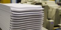 Stack of papers from high volume printing service in Townsville