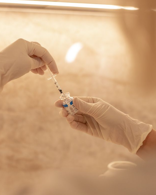 A Person Is Holding a Syringe in Their Hand — Rejuved in Bateau Bay, NSW