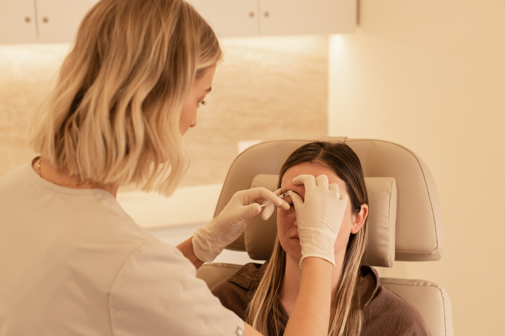 A Woman Is Getting a Botox Injection in Her Nose — Rejuved in Bateau Bay, NSW