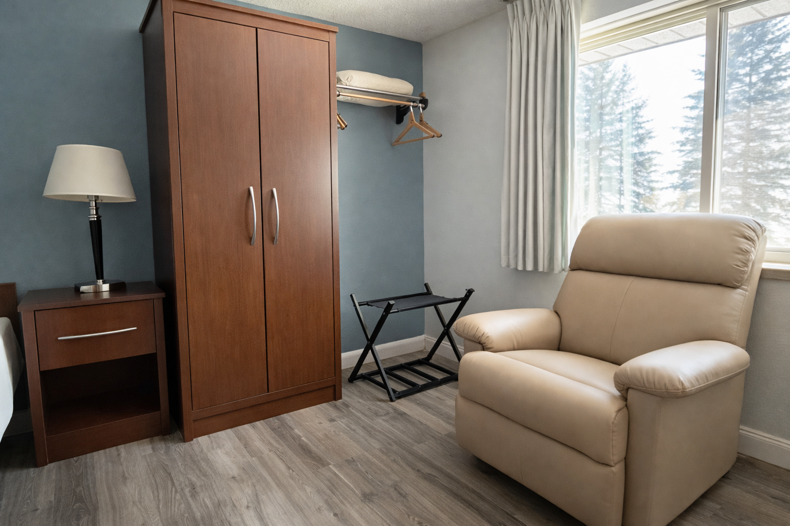 Yellow canoe on shore of calm lake, island with trees in background, sunny day.