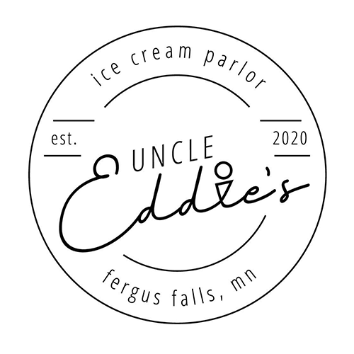 Burger with fries on a plate; burger has bacon, lettuce, and sauce, fries golden, small dipping sauces.