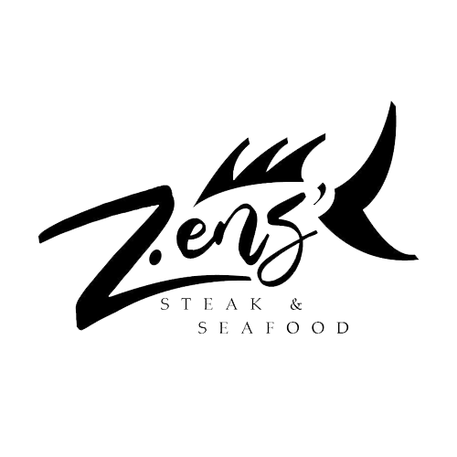 Burger with fries on a plate; burger has bacon, lettuce, and sauce, fries golden, small dipping sauces.