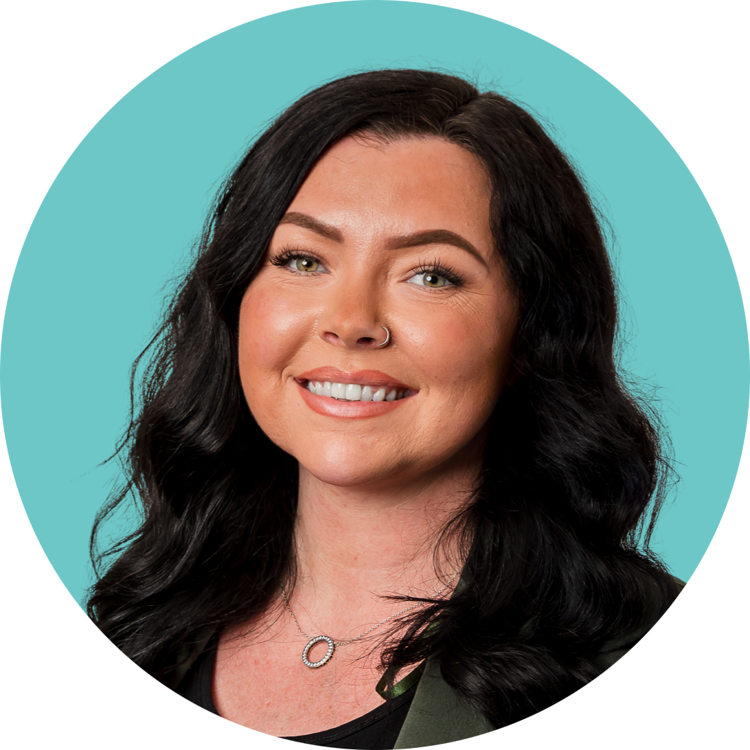 A woman with long black hair is smiling in a circle on a blue background.