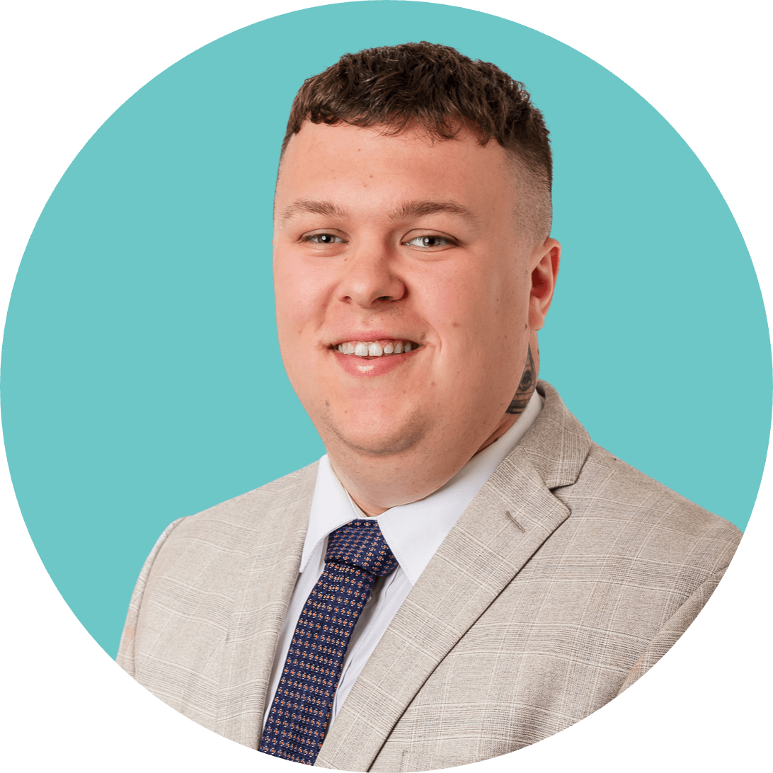 A man in a suit and tie is smiling in a circle.