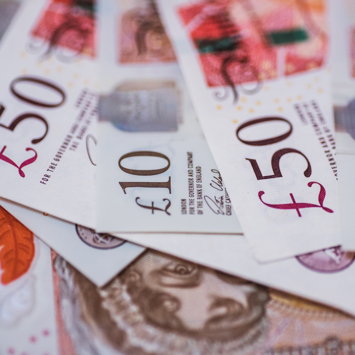 A stack of 50 and 10 pound notes