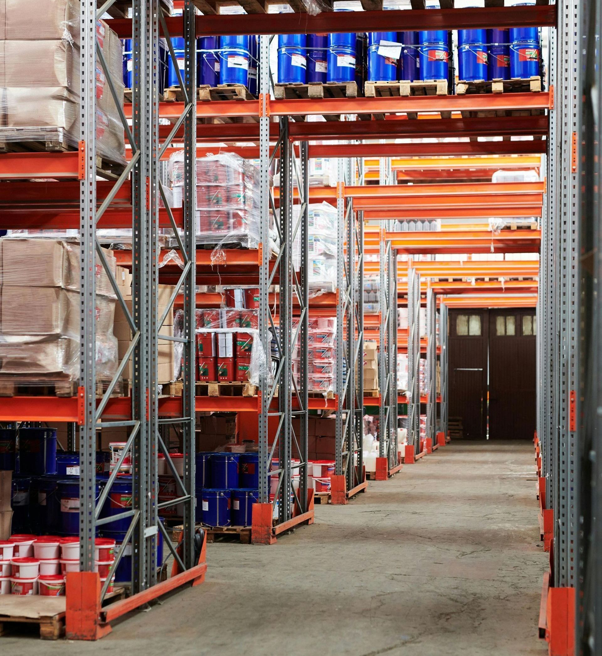 A warehouse filled with lots of shelves and barrels