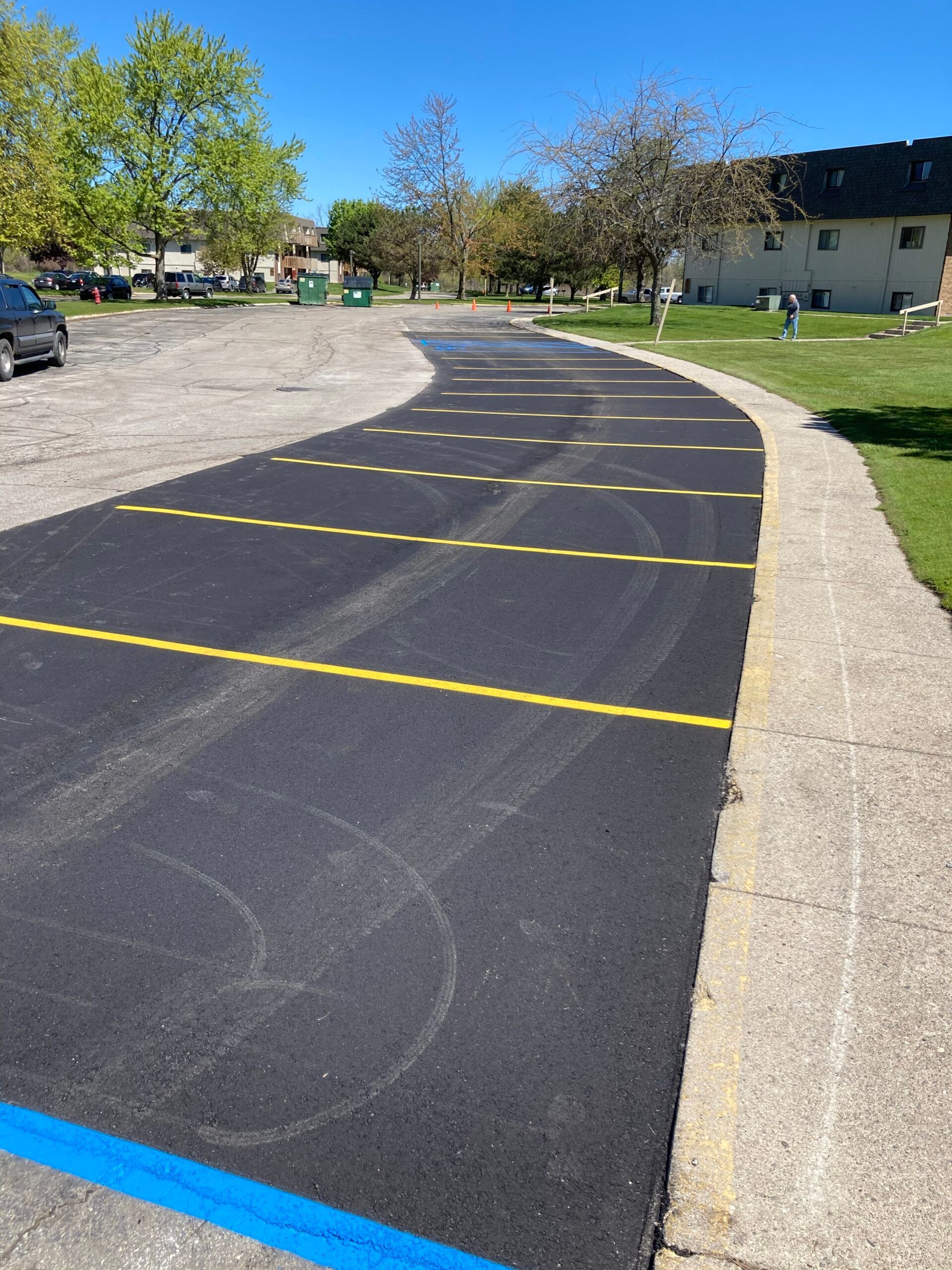 A parking lot with a blue line on the side of it