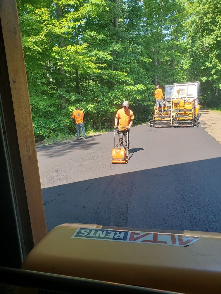 A group of men are working on a road.