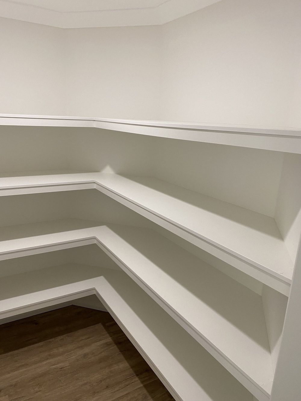 A Room With A Lot Of Shelves And A Wooden Floor — Cross Cabinets In Chevallum, QLD