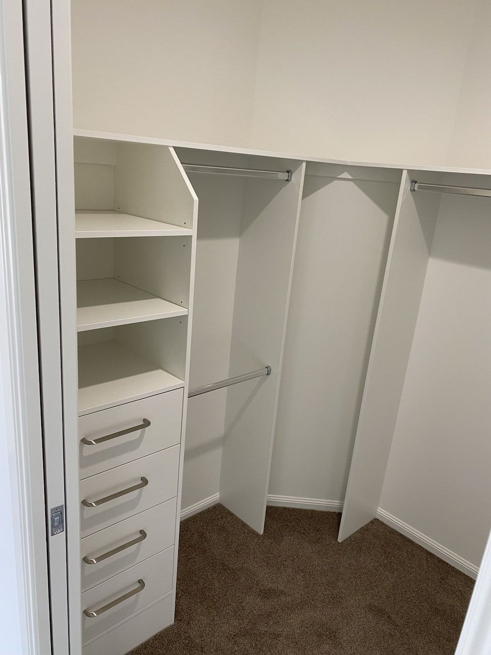 A Walk In Closet With White Shelves And Drawers And A Brown Carpet — Cross Cabinets In Chevallum, QLD