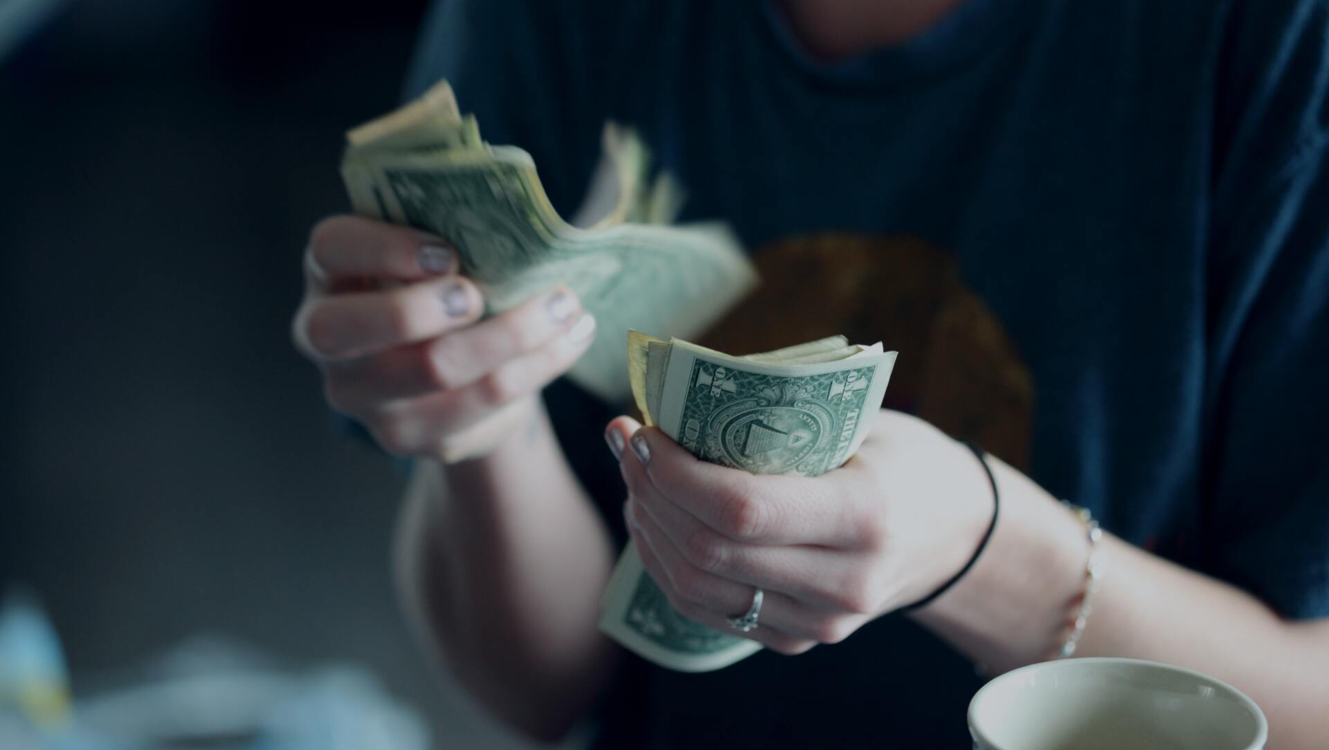 woman counting money - Ana Echeverri