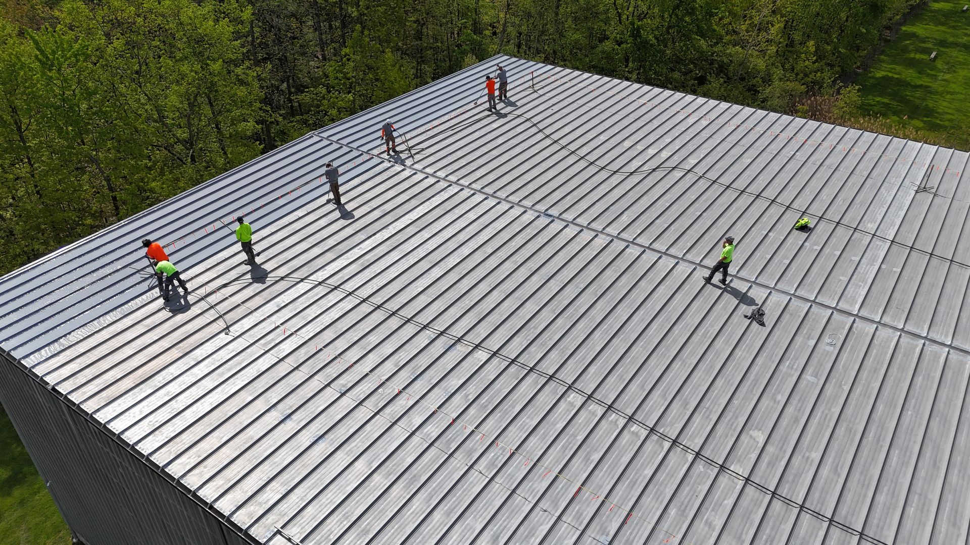 spray on roof coating system installed over the existing metal roof