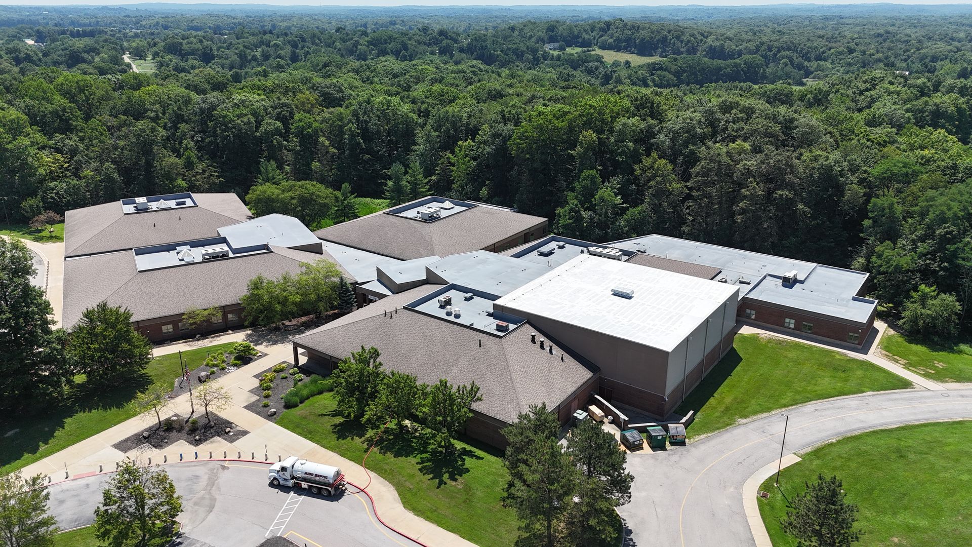 EPDM roof in Chagrin Falls, Ohio that's been restored by installed a silicone roof coating system over top.