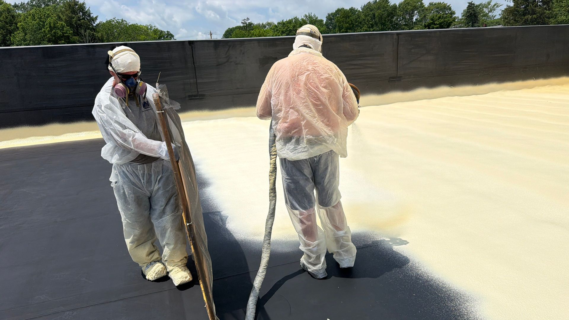 spray foam roofing being installed over an exiting commercial roof in Elyria, Ohio